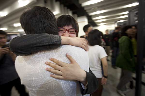 Bai Xi, who along with Ming helped me run the workshop, hugging me goodbye at the exhibition in Shantou Public Library.