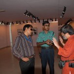 Police personnel visit the exhibition about Tibet at Drik galler