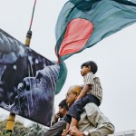 A boy sits on the shoulders of his freedom-fighter grandfather at Shahbagh Square. © Shahidul Alam/Drik/Majority World