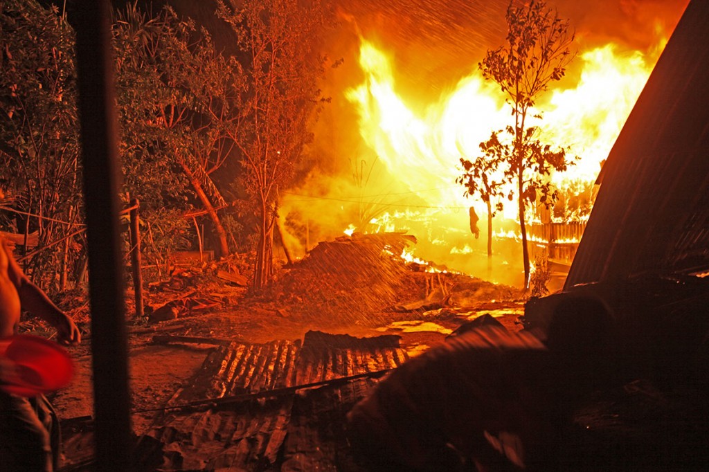 A fire broke out in a house in  Mahajanpara in Khagrachari in the Chittagong Hill Tracts. Neighbours and the fire brigade quickly responded. No one was hurt or injured. Photo: Shahidul Alam/Drik/Majority World