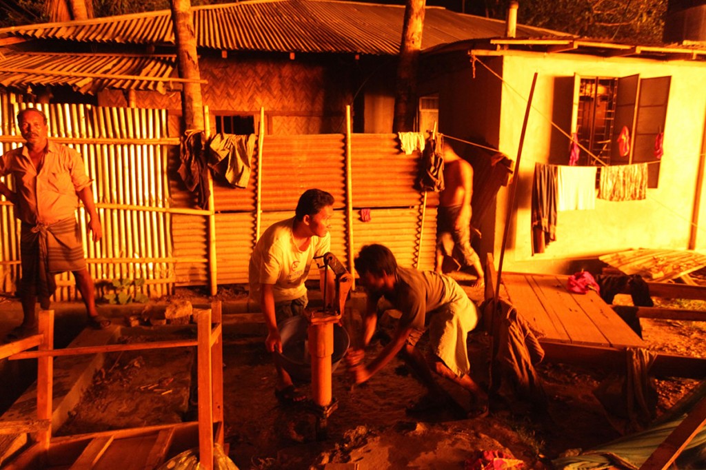 Neighbours were quick to respond, getting water from nearby tubewells. Jammed telephone networks hindered getting the information to the fire brigade. Photo: Shahidul Alam/Drik/Majority World