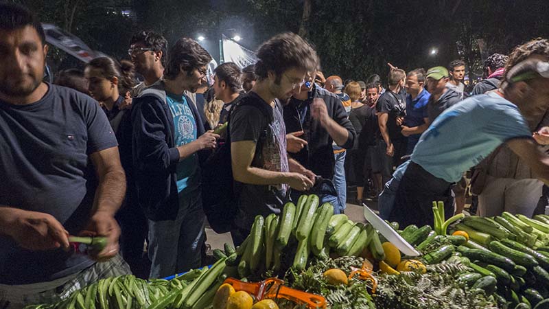 Hawkers doing brisk trade in cucumber sales which they playfully named "Taiyyap" after the prime minister of Turkey. Taksin Square. Istanbul. Photo: Shahidul Alam/Drik/Majority World