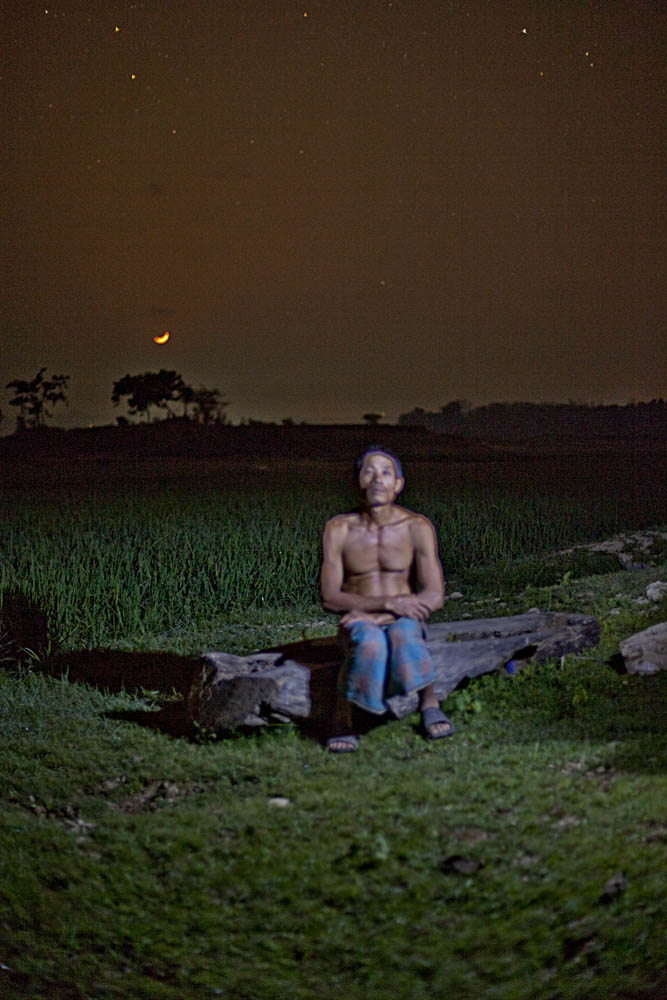 Kalpana's brother, who was also taken away, in the paddy field they had walked through that night. Photo: Shahidul Alam/Drik/Majority World