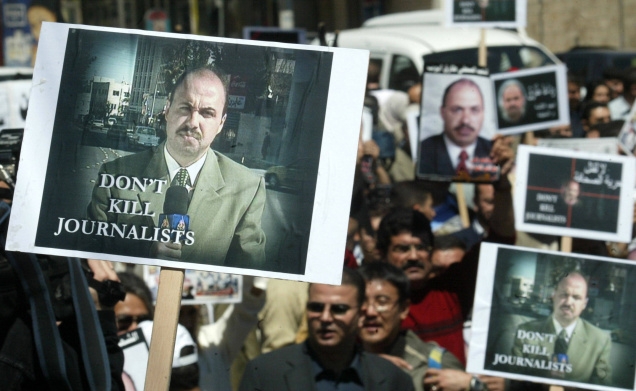 April 9, 2003: Jordanian journalists at a protest march in Amman to mourn the death of their colleague Tareq Ayyoub, a victim of a missile attack that hit the Al Jazeera bureau in Baghdad the previous day. Photo:ALI JAREKJI/REUTERS