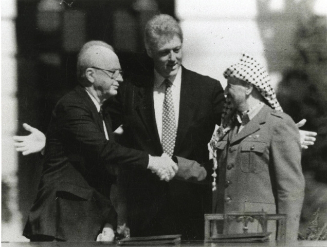 September, 1993: President Clinton gestures as Israeli Prime Minister Yitzhak Rabin (left) and Palestine Liberation Organisation Chairman Yasser Arafat shake hands after signing the peace accord at the White House in Washington. Photo:The Hindu Photo Archives