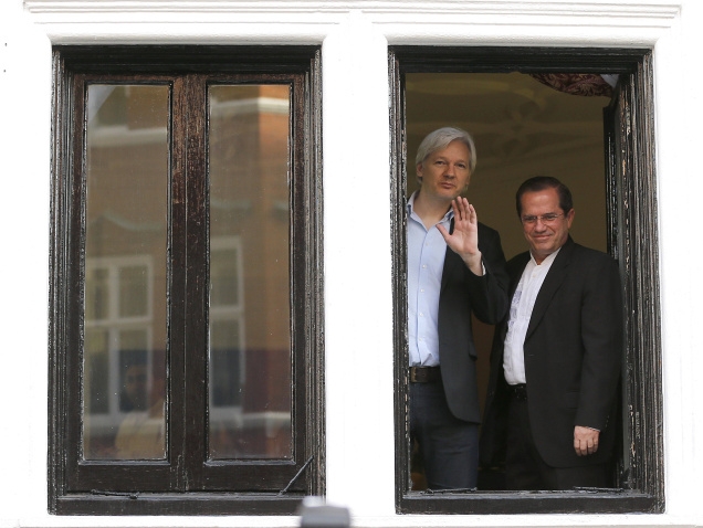 WikiLeaks founder Julian Assange (left) with Ecuador's Foreign Minister Ricardo Patino on the balcony of the Ecuadorian Embassy in London on June 16. Photo:Frank Augstein/AP