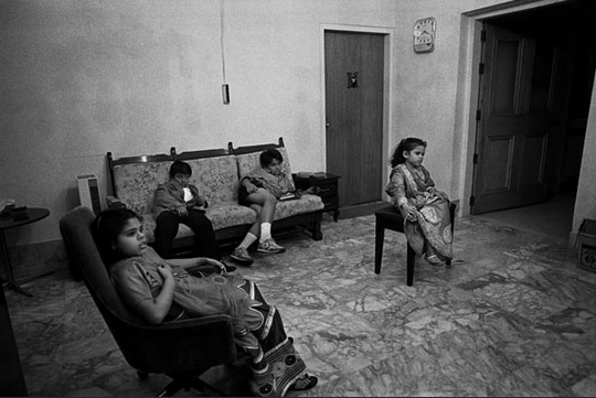 Children watch TV at the home of the bride during an upper class wedding ? Shahidul Alam/Drik/Majority World