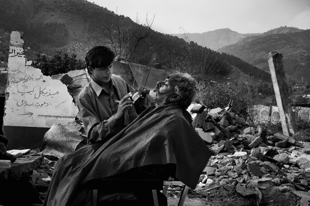 A barber shop in Ballakot, Kashmir, Pakistan. The story often missed is the resilience of the people and their ability to get on with their lives. ? Shahidul Alam/Drik/Majority World