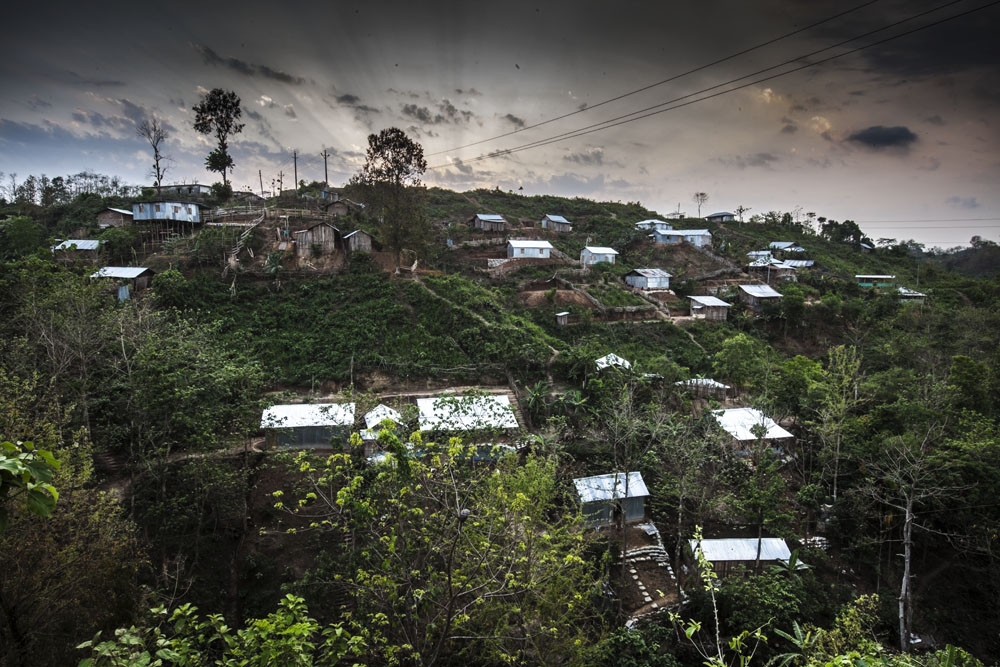 New settlements with glistening tin roofs dot the hillsides. According to Amnesty International as of June 2013 the Bangladeshi government had still not honored the terms of the peace accord nor addressed the Jumma peoples concerns over the return of their land. Amnesty estimate that there are currently 90,000 internally displaced Jumma families. Photo: Shahidul Alam/Drik/Majority World