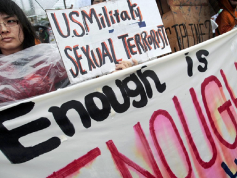 Protester at a rally against an alleged rape of a 14-year-old girl by an American serviceman in Okinawa islands, southwestern Japan. March 23, 2008. AP Photo/Itsuo Inouye